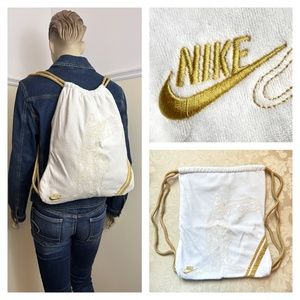 NIKE Greek goddess of Victory cream & gold embroidered bag